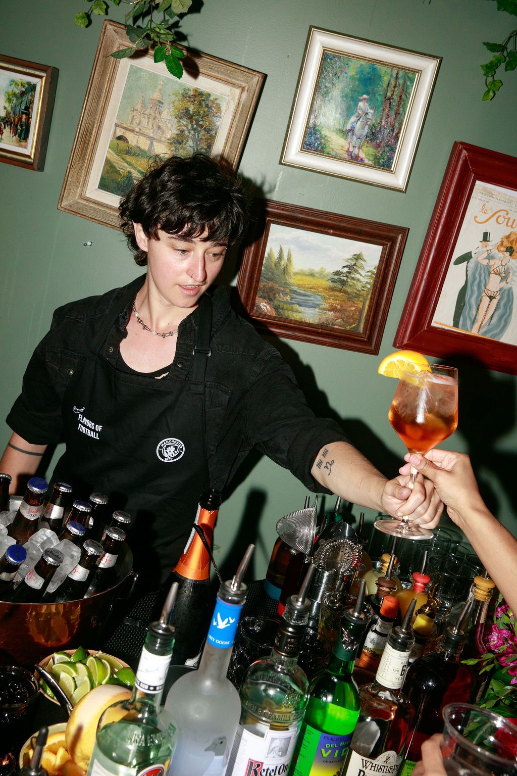 Bartender serving a drink at the Manchester City and Asahi event