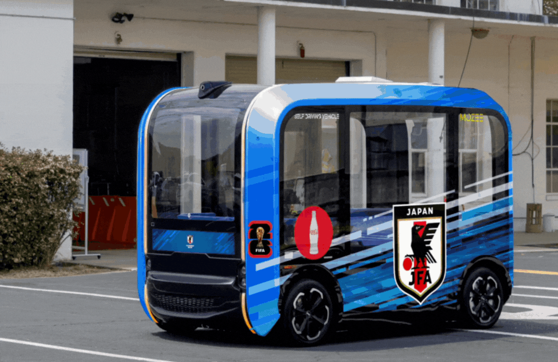 Autonomous shuttle displaying animated football campaign graphics
